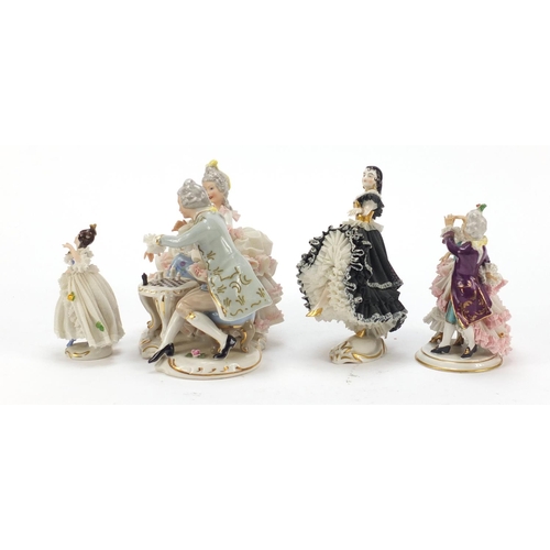 484 - Dresden, four German porcelain lace figurines including a group of a couple playing chess, the large... 