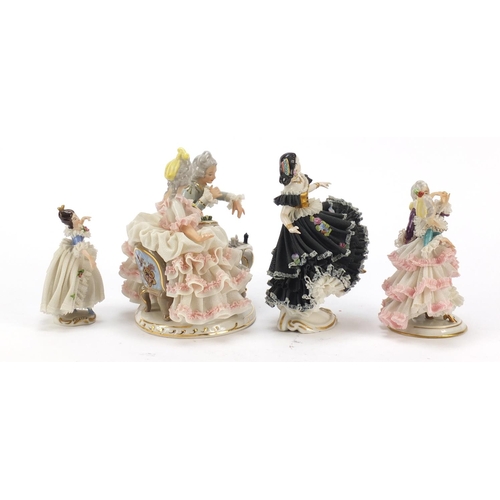 484 - Dresden, four German porcelain lace figurines including a group of a couple playing chess, the large... 