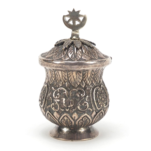 3081 - Persian silver coloured metal baluster cup with hinged lid embossed with flowers and foliage, 13cm h... 