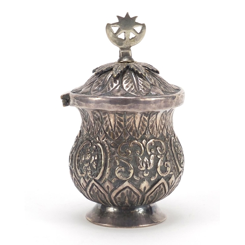 3081 - Persian silver coloured metal baluster cup with hinged lid embossed with flowers and foliage, 13cm h... 