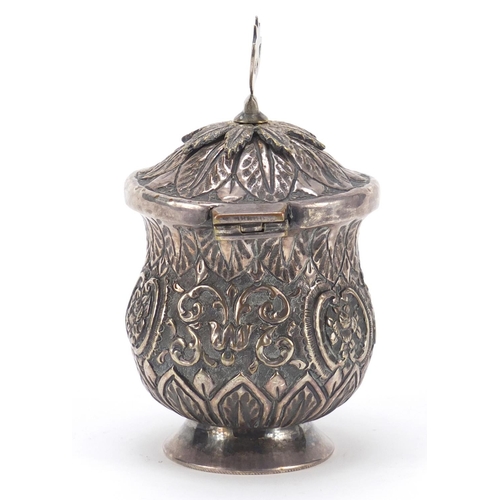 3081 - Persian silver coloured metal baluster cup with hinged lid embossed with flowers and foliage, 13cm h... 