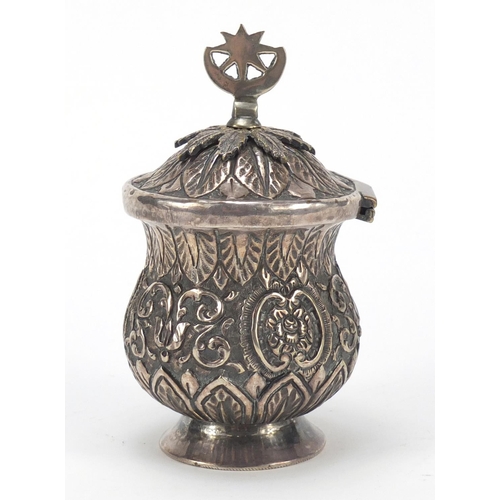 3081 - Persian silver coloured metal baluster cup with hinged lid embossed with flowers and foliage, 13cm h... 