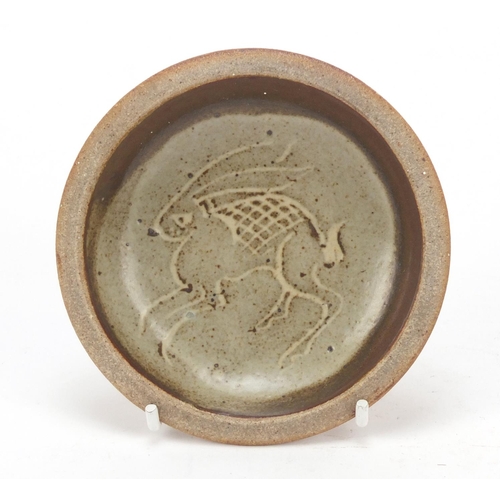 209 - Attributed to Bernard Leach, St Ives Studio pottery dish incised with a hare, 11cm in diameter