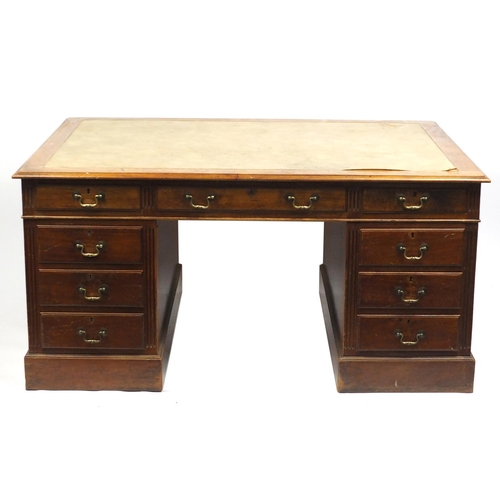 1499 - Mahogany twin pedestal desk fitted with a series of drawers, 74cm H x 152cm W x 107cm D