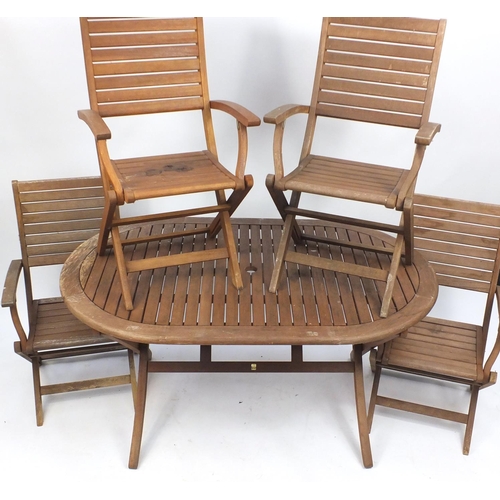 1593 - Teak folding garden table and four chairs, the table 76cm H x 147cm W x 91 D, the chairs each 94cm H