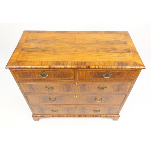 1454 - Antique walnut feather and cross banded five drawer chest fitted with two short above three long gra... 