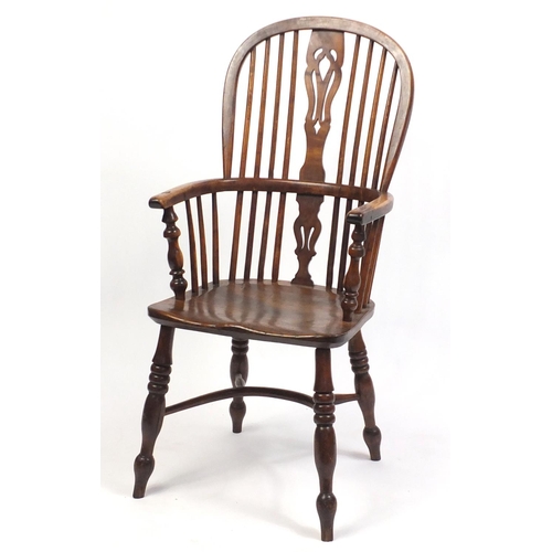 1555 - Victorian elm and yew Windsor chair with crinoline stretcher, 106cm high