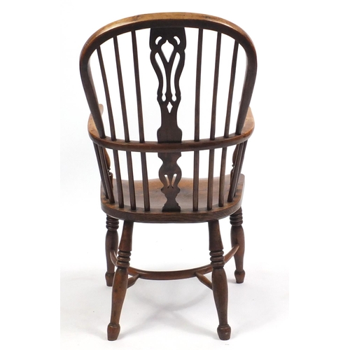 1498 - Victorian elm and yew Windsor chair with crinoline stretcher, 106cm high