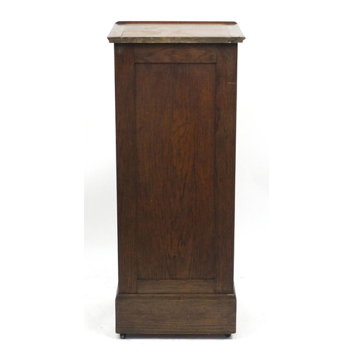 1455 - 1920's oak filing cabinet with tambour front and easel top, 119.5cm H x 49.5cm W x 43.5cm D