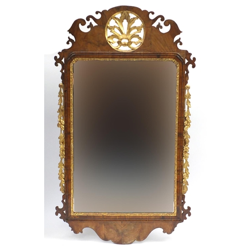 1467 - Georgian partially gilt walnut wall mirror with bevelled pate, carved with flowers, leaves and berri... 
