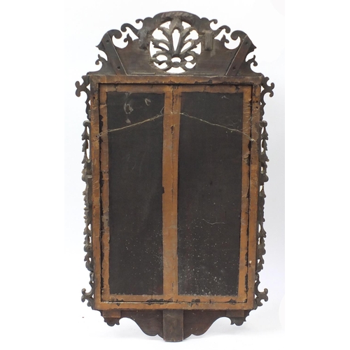 1467 - Georgian partially gilt walnut wall mirror with bevelled pate, carved with flowers, leaves and berri... 