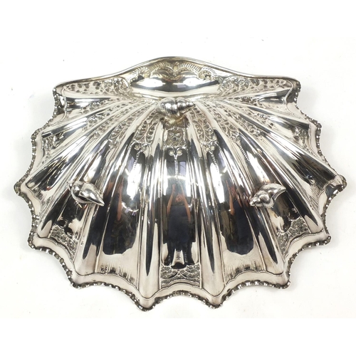 3031 - Atkin Brothers, large Victorian silver shell shaped bowl embossed with flowers and raised on three s... 