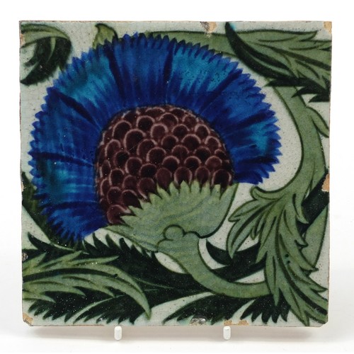 211 - William De Morgan, Arts & Crafts pottery BBB tile hand painted with a stylised thistle and foliage, ... 