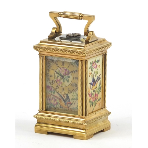 3067 - Russian silver gilt miniature carriage clock with hand painted porcelain panels, with double headed ... 