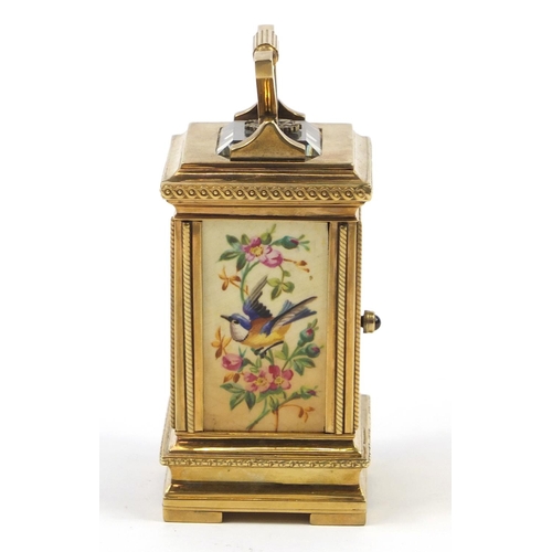 3067 - Russian silver gilt miniature carriage clock with hand painted porcelain panels, with double headed ... 