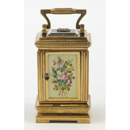 3067 - Russian silver gilt miniature carriage clock with hand painted porcelain panels, with double headed ... 