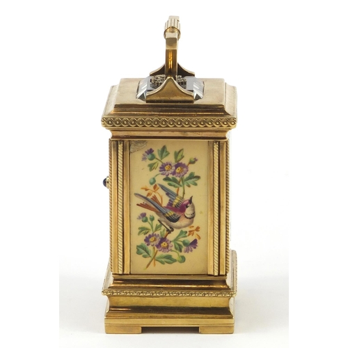 3067 - Russian silver gilt miniature carriage clock with hand painted porcelain panels, with double headed ... 