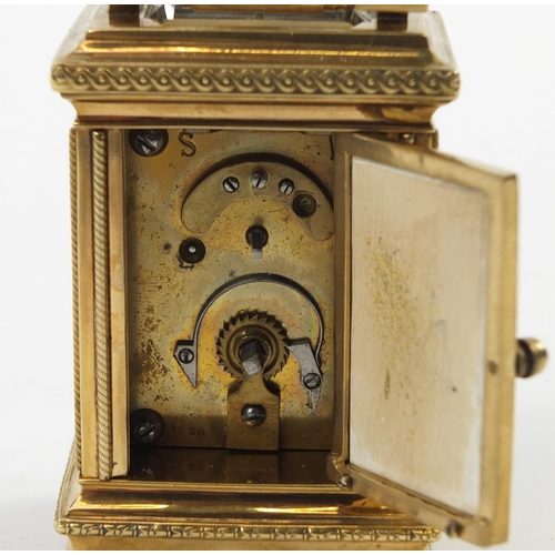 3067 - Russian silver gilt miniature carriage clock with hand painted porcelain panels, with double headed ... 