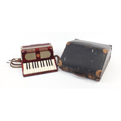 540 - Worldmaster red marbleised accordion with case