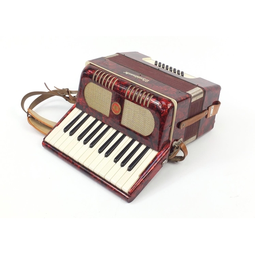 540 - Worldmaster red marbleised accordion with case