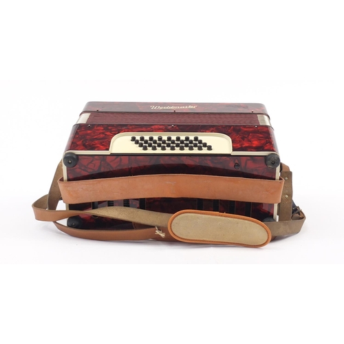 540 - Worldmaster red marbleised accordion with case