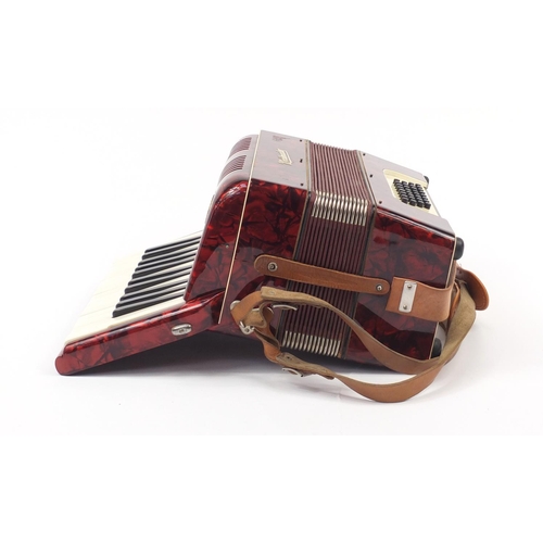 540 - Worldmaster red marbleised accordion with case