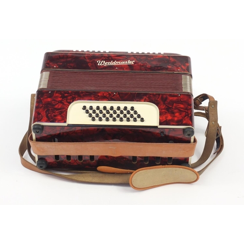 540 - Worldmaster red marbleised accordion with case