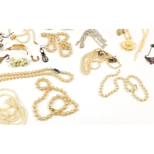 3733 - Costume jewellery including a simulated pearl necklace with silver gilt clasp, ivory necklace, gold ... 