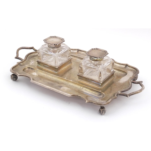 3059 - Thomas Bradbury & Sons, Edward VII silver desk stand  with a pair of heavy cut glass inkwells, raise... 