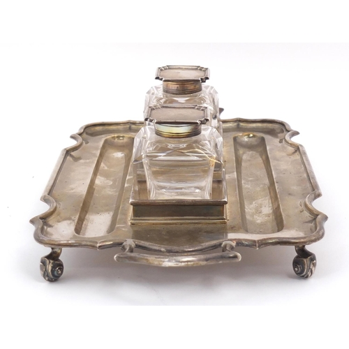 3059 - Thomas Bradbury & Sons, Edward VII silver desk stand  with a pair of heavy cut glass inkwells, raise... 