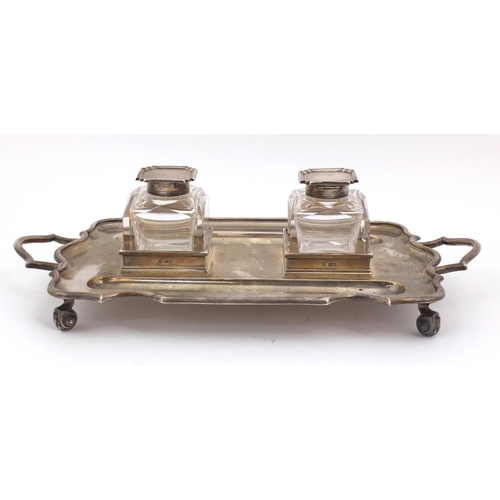 3059 - Thomas Bradbury & Sons, Edward VII silver desk stand  with a pair of heavy cut glass inkwells, raise... 