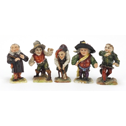 493 - Five 19th century Continental porcelain dwarfs, factory marks to the bases, the largest 9cm high