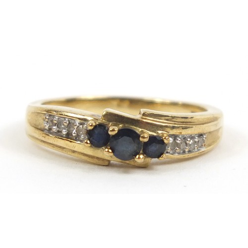 2383 - 9ct gold sapphire and diamond crossover ring, size P, 3.2g