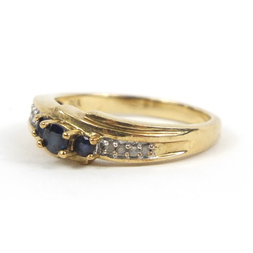 2383 - 9ct gold sapphire and diamond crossover ring, size P, 3.2g