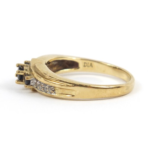 2383 - 9ct gold sapphire and diamond crossover ring, size P, 3.2g