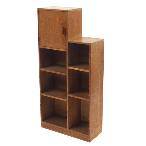 1451 - Heal's, Art Deco limed oak open bookcase with cupboard, inset Heal's plaque to the reverse, 109cm H ... 