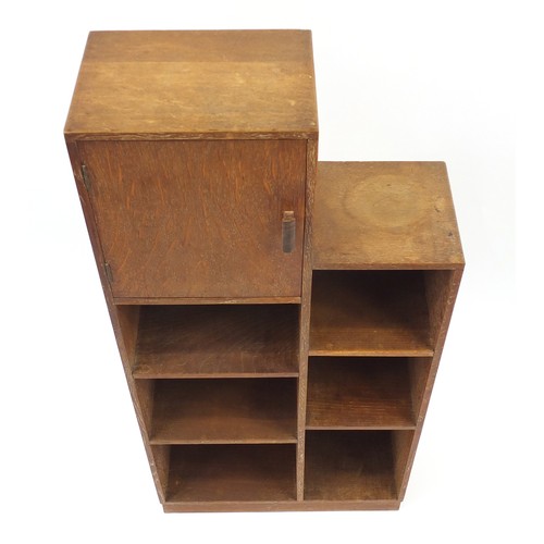 1451 - Heal's, Art Deco limed oak open bookcase with cupboard, inset Heal's plaque to the reverse, 109cm H ... 