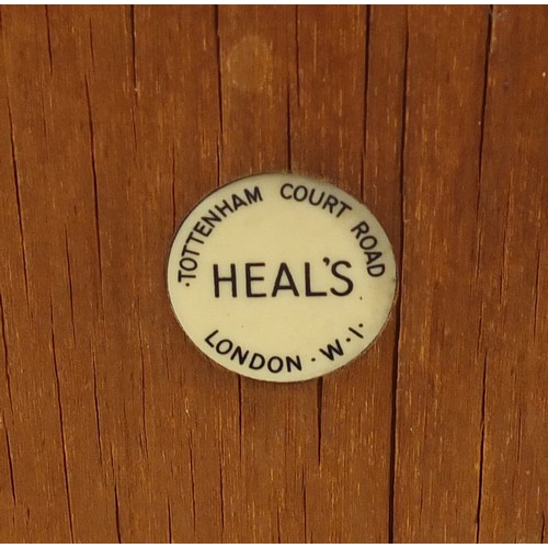 1451 - Heal's, Art Deco limed oak open bookcase with cupboard, inset Heal's plaque to the reverse, 109cm H ... 