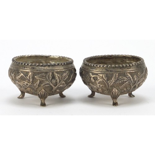 3078 - Pair of Burmese silver coloured metal open salts, embossed with animals and trees, 5cm in diameter, ... 