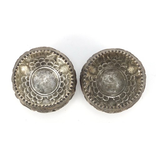 3078 - Pair of Burmese silver coloured metal open salts, embossed with animals and trees, 5cm in diameter, ... 