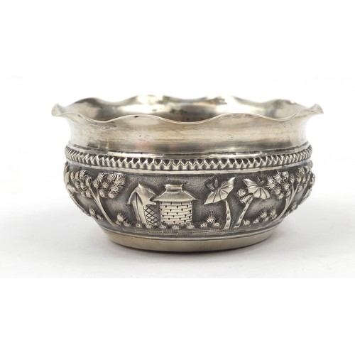 3077 - Burmese silver coloured metal bowl, embossed with figures in a landscape, 5cm high x 10.5cm in diame... 