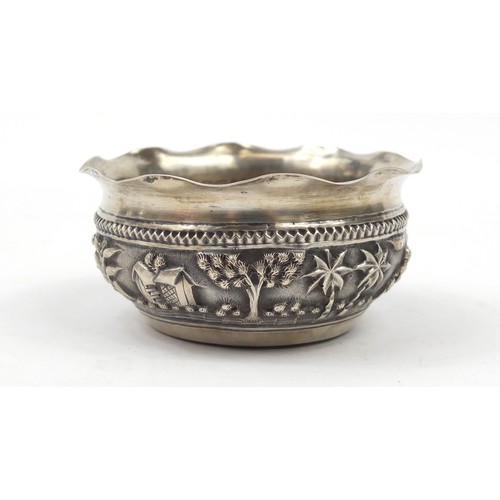 3077 - Burmese silver coloured metal bowl, embossed with figures in a landscape, 5cm high x 10.5cm in diame... 