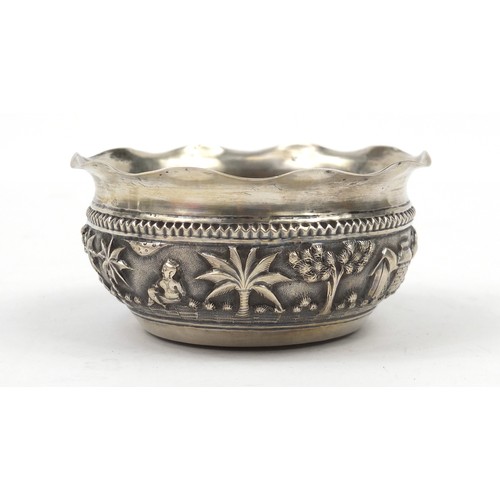 3077 - Burmese silver coloured metal bowl, embossed with figures in a landscape, 5cm high x 10.5cm in diame... 