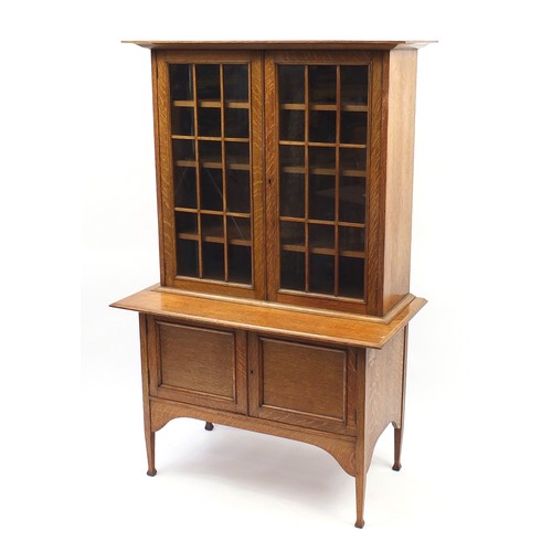 1465 - Liberty & Co style, Arts & Crafts oak glazed bookcase on stand with adjustable shelves, 169cm H x 10... 