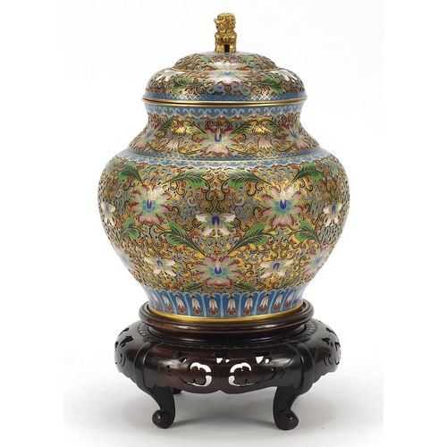32 - Chinese cloisonné baluster vase and cover raised on carved hardwood stand, enamelled with flower hea... 