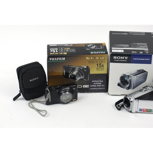 3043 - Two boxed digital cameras compriding Fujifilm and Sony, Tom Tom, sold as seen and not tested