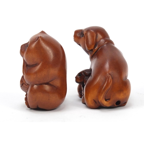 230 - Two Japanese boxwood Netsukes including one of two dogs, the largest 4cm high