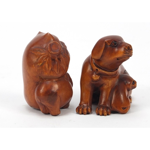 230 - Two Japanese boxwood Netsukes including one of two dogs, the largest 4cm high