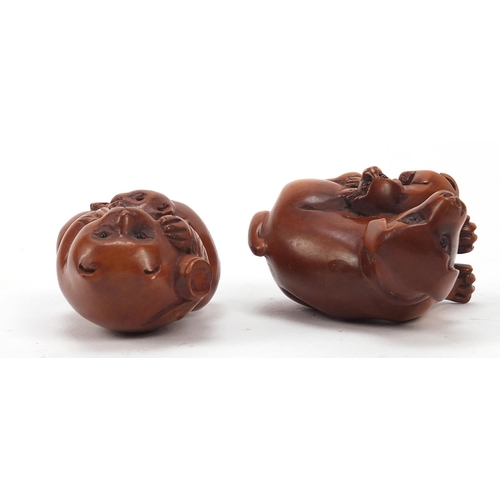 230 - Two Japanese boxwood Netsukes including one of two dogs, the largest 4cm high