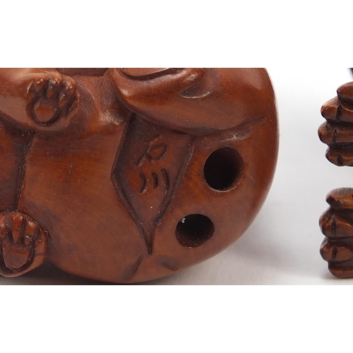 230 - Two Japanese boxwood Netsukes including one of two dogs, the largest 4cm high
